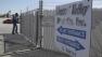 A security guard opens the gate at the Central Valley Meat Co., the California slaughterhouse shut down by federal regulators after they received video showing dairy cows being repeatedly shocked and shot before being slaughtered.