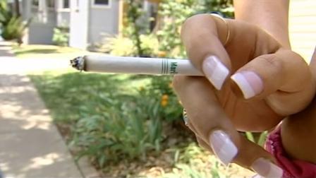 Hand holding cigarette