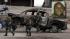 Mountain manhunt for ex-cop accused of... :: A burned-out pickup truck belonging to ex-Los Angeles police officer Christopher Dorner is towed after it was discovered in Big Bear, Calif, Thursday, Feb. 7, 2013.