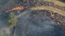 A pair of tamed but persistent wildfires still burned in the hills and mountains around Interstate 5 after a wild week of burning brush in the area north of Los Angeles.
