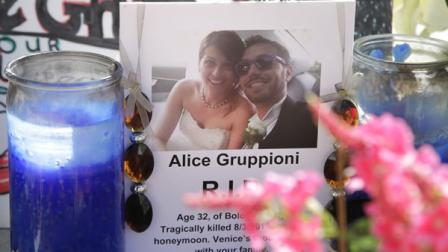 A card showing the photo of Italian newlywed Alice Gruppioni and her husband Christian Casadei. (AP Photo/Jae C. Hong)