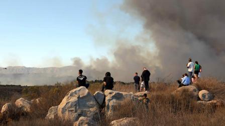 This Saturday Oct. 5, 2013 photo provided by the U.S. Marine Corps Base Camp Pendleton shows fire burning in the Lake ONeill vicinity on Camp Pendleton, Calif. (AP Photo/USMC, Cpl. Sarah Wolff Diaz)