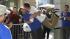 Love or addiction? What's your iPhone... :: A customer jumps into the arms of an Apple employee outside the Apple Store in Covent Garden, to celebrate his purchase of the new iPhone 4S, which went on sale in London, Friday, Oct. 14, 2011.