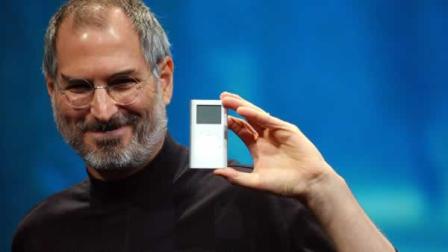 FILE - Apple CEO Steve Jobs displays his companys new product, the Mini-Ipod, at the Macworld Conference and Expo in San Francisco, Tuesday, Jan. 6, 2004. (AP Photo/Marcio Jose Sanchez)
