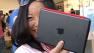 Woman holds Apples new iPad Mini