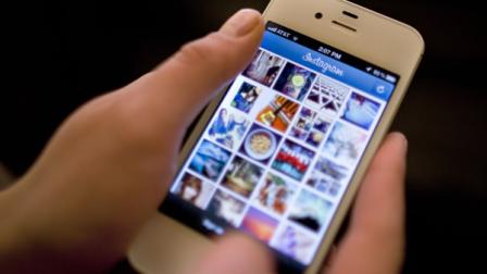 Instagram is demonstrated on an iPhone