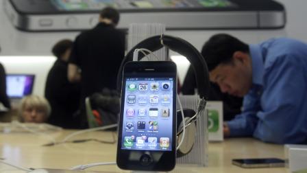 The iPhone 4 is shown on display at an Apple Store in San Francisco, Friday, Nov. 26, 2010