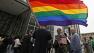  same-sex marriage supporters gather outside a federal building