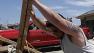 Chad Allcox, left, helps his friend Kevin McElvany, right, the home owner, clear debris away from his destroyed home from Mondays tornado Wednesday, May 22, 2013, in Moore, Oklahoma
