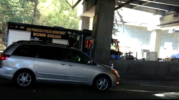 The San Francisco Bomb Squad investigates a suspicious device on the Bay Bridge Friday afternoon.

