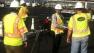 Construction crews put in striping before toll plaza near Bay Bridge