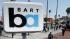 A man walks under a sign for the 24th Street Mission Bay Area Rapid Transit (BART) station in San Francisco, Monday, July 1, 2013. (AP Photo/Jeff Chiu)