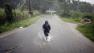 A man wades through a flooded street after hurricane Irene hit the area in Naguabo, Puerto Rico, Monday, Aug. 22, 2011.