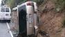 A mini-van on its side