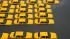 A parking lot full of yellow cabs is flooded as...