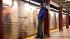 A commuter waits as the first A train approaches...