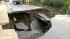 20-foot sinkhole opens up on road in Lafayette :: Fast-running creek washes road away in Lafayette