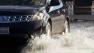 Car driving through flood waters in the North Bay