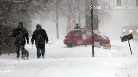 People walking dog in Midwest snowstorm