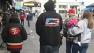 People bundled up, walking along SFs Fishermans Wharf