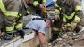 Rescue workers dig through the rubble of a collapsed wall at the Plaza Tower Elementary School to free trapped students in Moore, Okla., following a tornado Monday, May 20, 2013.