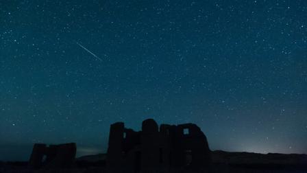 In this photo provided by Kevin Clifford, a meteor from the annual Perseid meteor shower falls from space over ruins at Fort Churchill State Historic Park on Sunday, Aug. 12, 2012, in Silver Springs, Nev.
