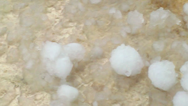 An isolated thunderstorm brings a mix of hail...