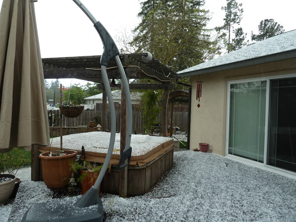 An isolated thunderstorm brings a mix of hail and snow fell in Fairfield and Suisun City today. The planters are outside the county government center. (Photo submitted by Jeanie via uReport)