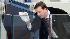 A U.S. Secret Service agent cleans the glass...