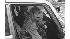 Actress Farrah Fawcett enters a car with an...