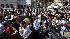 Fans and media wait outside the UCLA Medical...