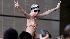 A Michael Jackson fan crowd surfs outside the...