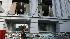 An SA security guard inspects the damage after...