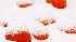 Snow gathers on pumpkins at a sales lot in...