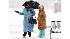 Women wait for a bus during a snow storm in...