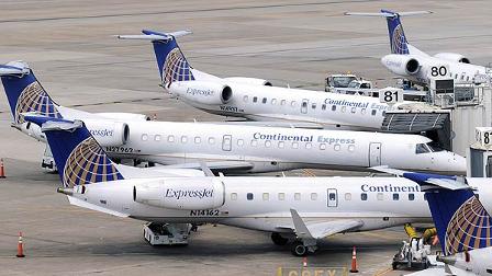 Continental Express jets line up outside a terminal at Houstons Bush Intercontinental Airport Wednesday, June 17, 2009. (AP Photo/Pat Sullivan)