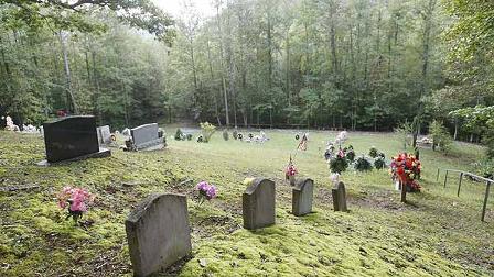 Graves dot a hillside at the Hoskins Cemetery in rural Clay County near Manchester, Ky., Thursday, Sept. 24, 2009. It was near this cemetery census worker Bill Sparkman was found dead. (AP Photo/\Ed Reinke)