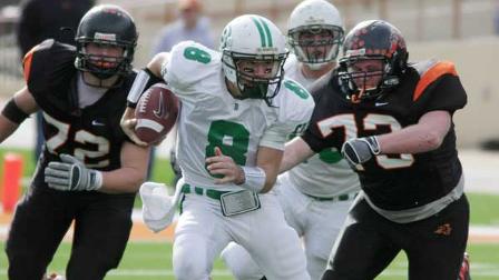Brenham quarterback Ty Schlottmann (8) scrambles as he is pursued by Aledo linemen Cody Brooks, right, and Michael Williams during the UIL Class 4A-Division 2 Football State Championship in Austin, Texas on Saturday, Dec. 19, 2009. Aledo won 35-21. (AP Photo/Jack Plunkett)