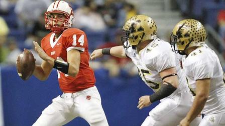 Katys Brooks Haaks (14) scrambles as Abilene defenders Hunter Cooke (45) and Anthony Carriola (41) pursue during the second quarter of a Class 5A Division I state high school football final in San Antonio, Saturday, Dec. 19, 2009. (AP Photo/Eric Gay)