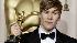 Writer Dustin Lance Black holds the Oscar for...
