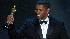 Denzel Washington accepts his Oscar for best...