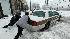 People help to free a cab stuck in the snow...