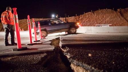 A car passes over a crack on the road at the 30th kilometer of the Mexicali-Tijuana highway made by a 7.2 earthquake in Mexicali, Mexico, Sunday, April 4, 2010. According to the USGS a 6.9 magnitude eartquake was register 26 km (16 miles) south west from Guadalupe Victoria, Baja California, Mexico. (AP Photo/Guillermo Arias)