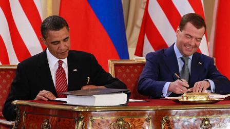 President Barack Obama signs the New START treaty with Russian president Dmitry Medvedev at the Prague Castle in Prague Thursday, April 8, 2010. (AP Photo/Alex Brandon)