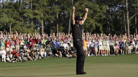 Phil Mickelson celebrates on the 18th green after winning the Masters golf tournament in Augusta, Ga., Sunday, April 11, 2010. (AP Photo/David J. Phillip)