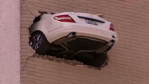 car through wall