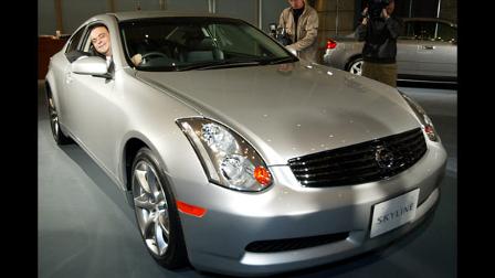 Nissan Motor Co. Chief Executive Officer Carlos Ghosn smiles as he sits behind the wheel of fully redesigned Skyline coupe in Tokyo Thursday, Jan. 16, 2003. The car was launched as the Infiniti G35 Sports Coupe in North America and has won 2003 Car of the Year by Motor Trend Magazine. Nissan is in the middle of a three-year revival plan that calls for selling one million more cars in three years. (AP Photo/Shizuo Kambayashi)