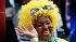 Pupils from St Joseph's Primary School with their faces painted in the participating country flags wait for a special event to mark the start of South Africa World Cup Soccer at Trafalgar Square in London and to show support for England's bid to host the 2018 FIFA World Cup, Friday, June 11, 2010. (AP Photo/Sang Tan)