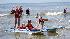 Enthusiastic campers take to the waves off the...
