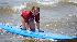 Enthusiastic campers take to the waves off the...